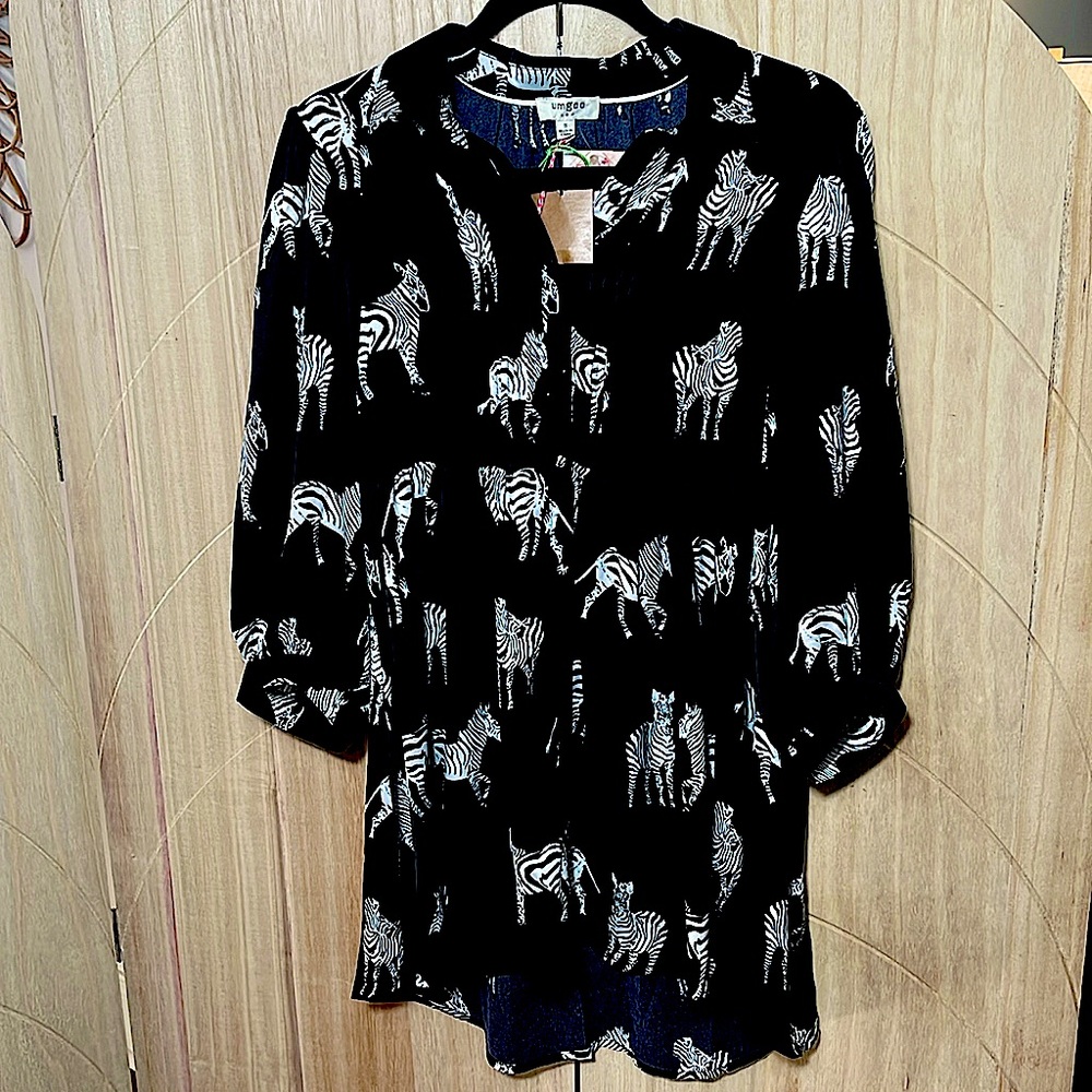 Black silk Zebra print dress. Bell sleeve and pleated front with working buttons